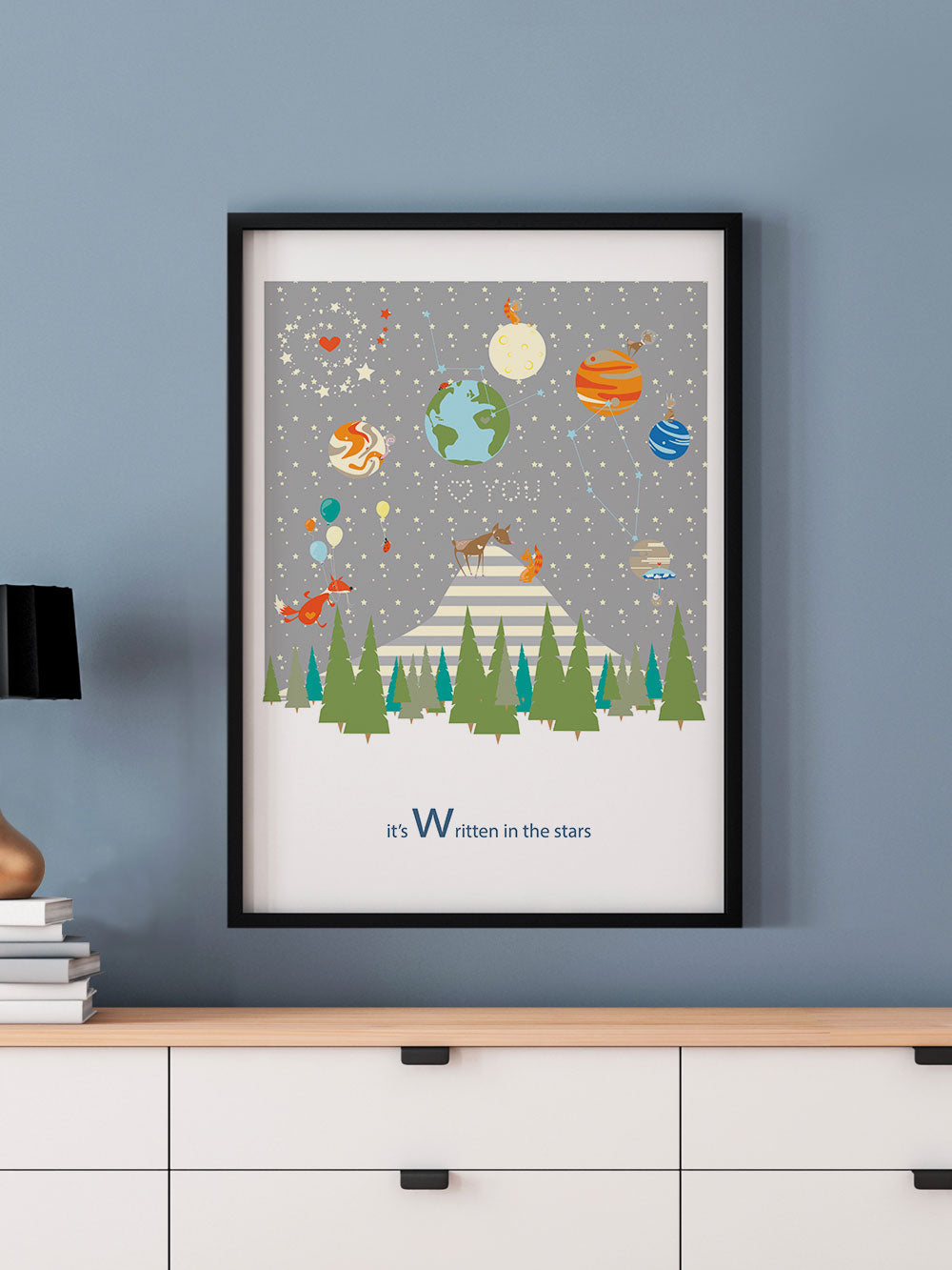Written in the Stars Woodland Print in a frame on a wall