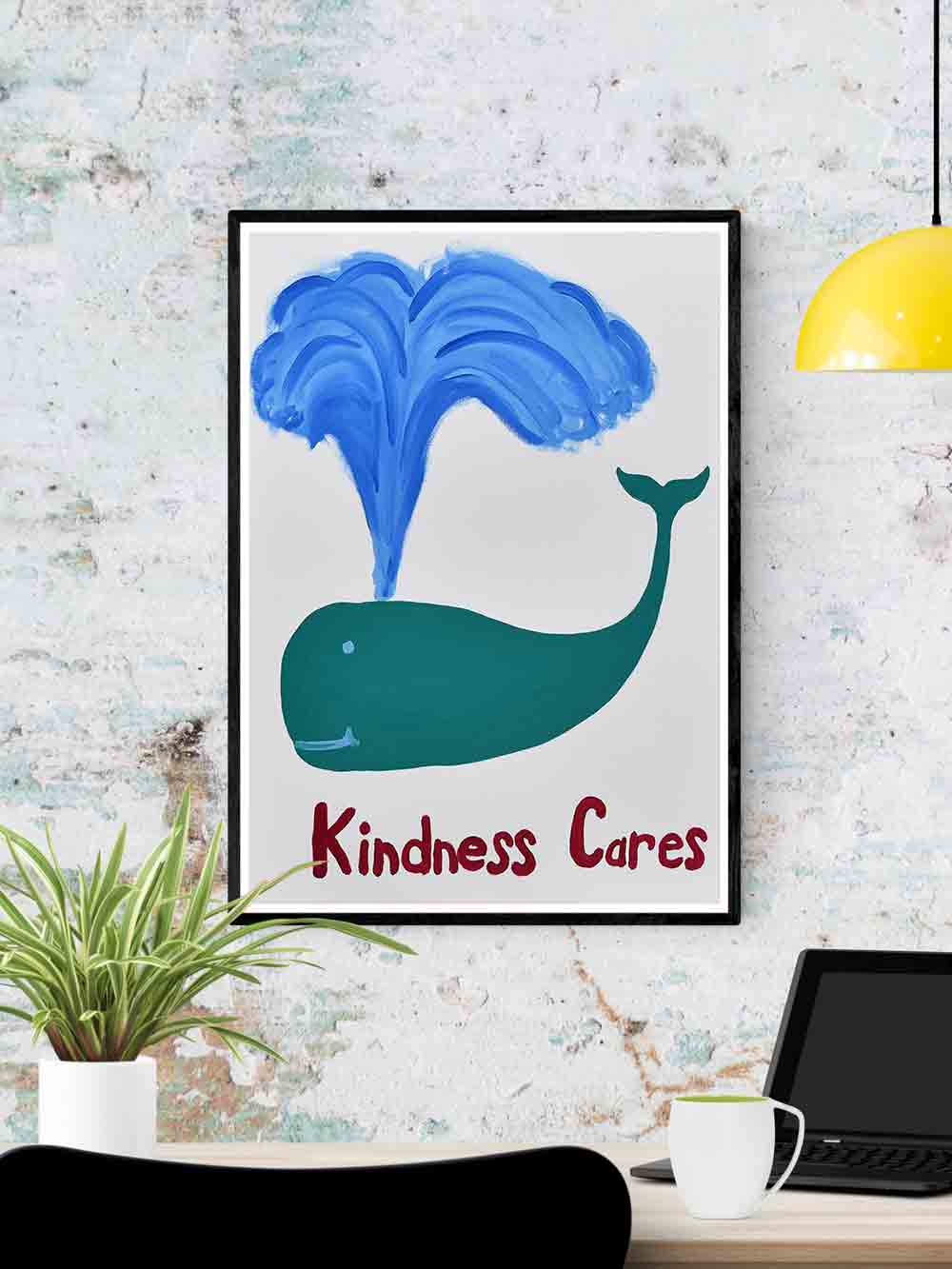 Kindness Cares Quirky Art Print in a frame on a wall