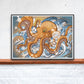 Octopus Sea Creature Print in a frame on a shelf