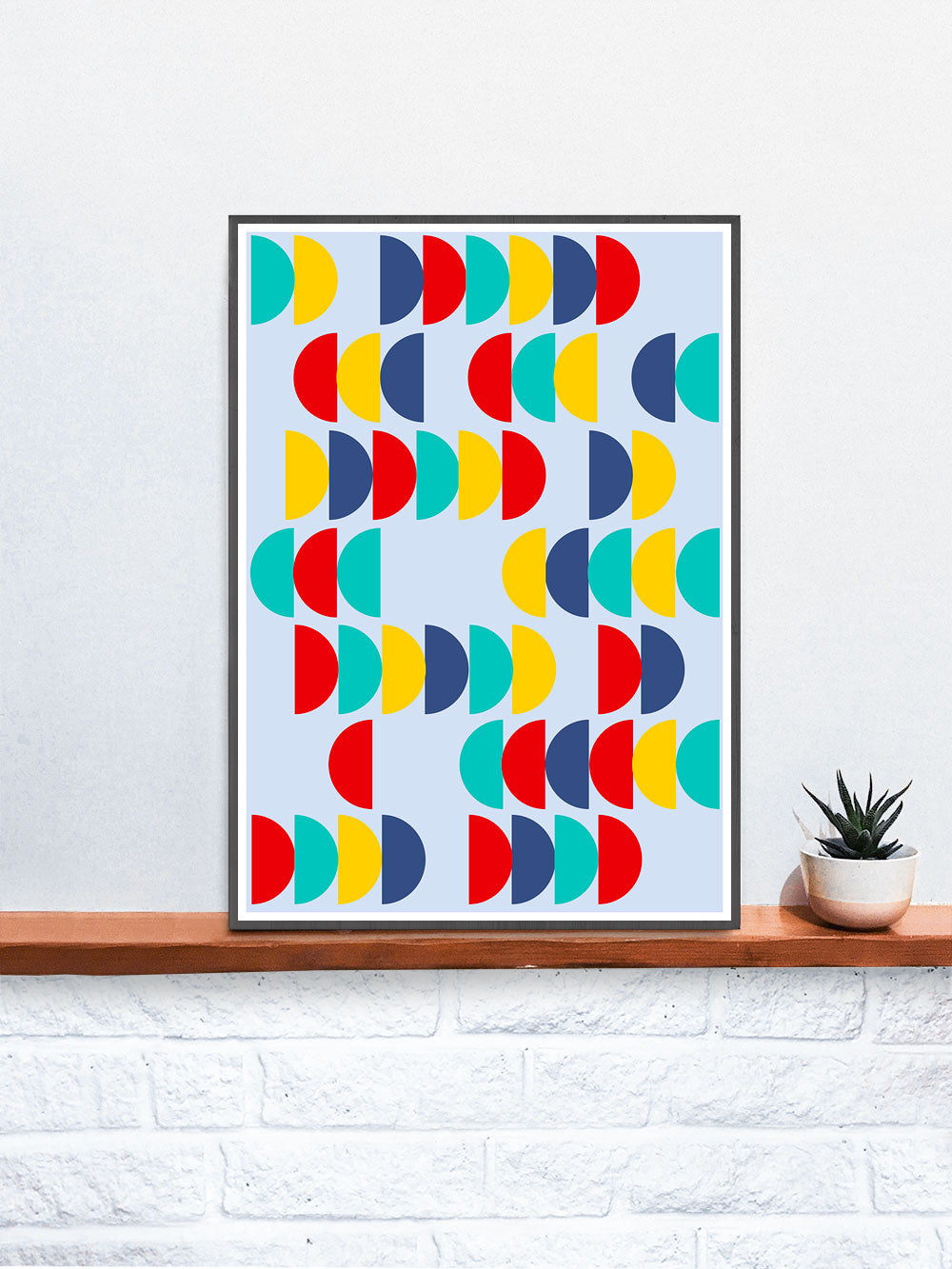 Pop Scales 2 Semi Circle Design Print in a frame on a shelf