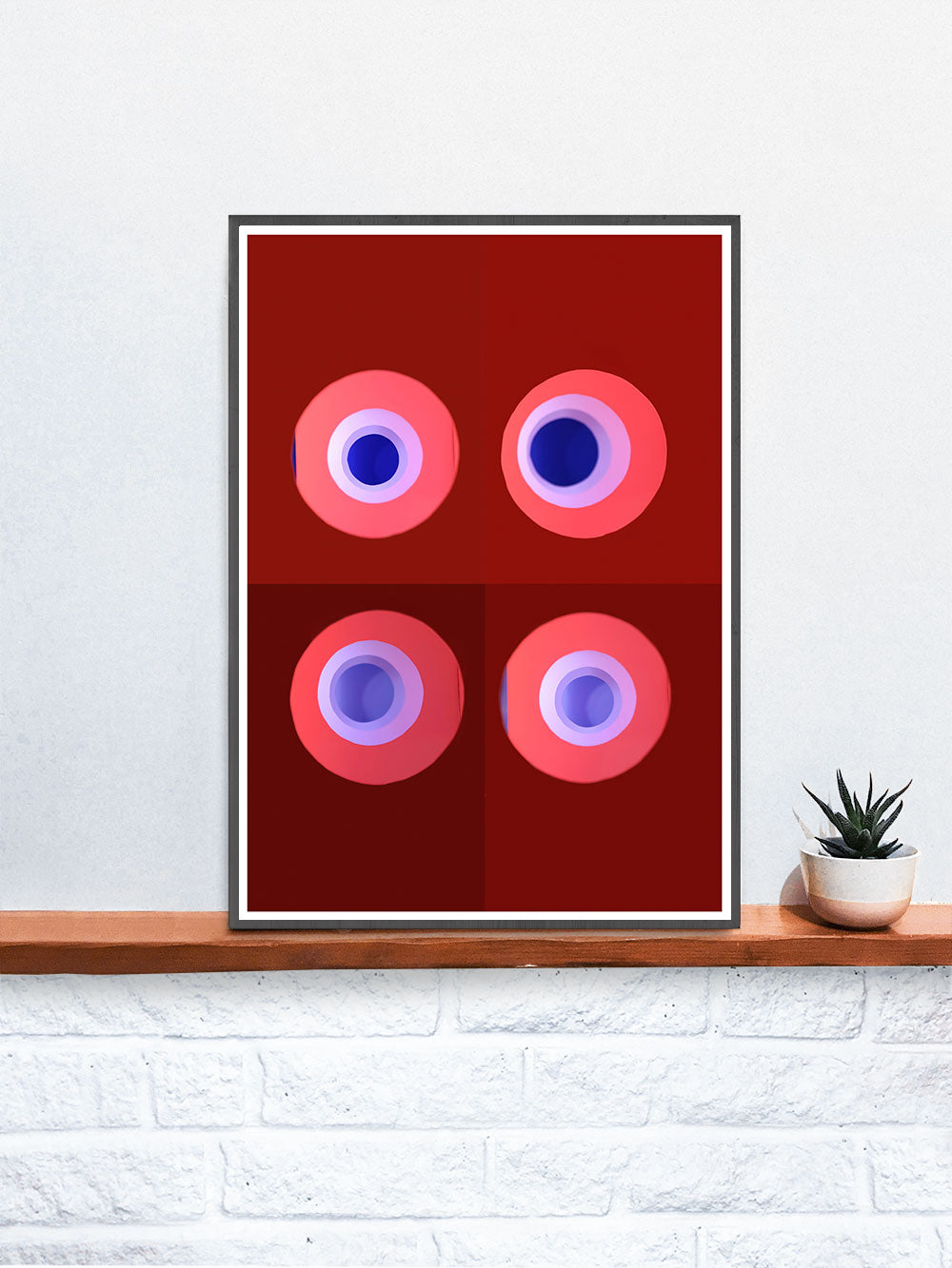 Red and Blue Minimal Art Print in a frame on a shelf