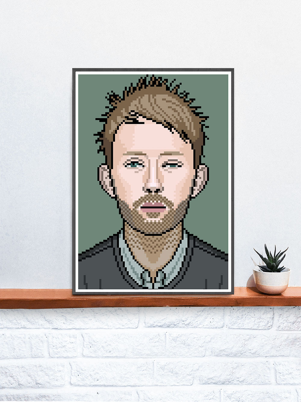 Thom Radiohead Art Illustration in a frame on a shelf